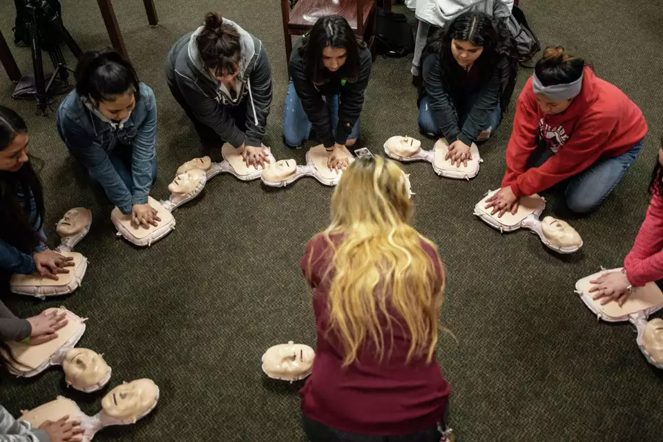 UIWSOM student speaks to high school students.