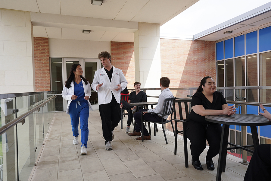 Students walking just outside of a UIWSOM building